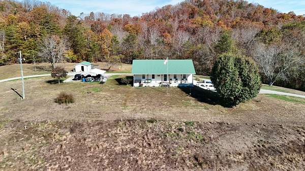 71.5 Acres of Land with Home for Sale in Liberty, Kentucky