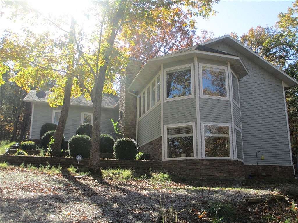 1.63 Acres of Land with Home for Sale in Holiday Island, Arkansas