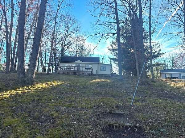 0.66 Acres of Land with Home for Sale in Harrison, Michigan