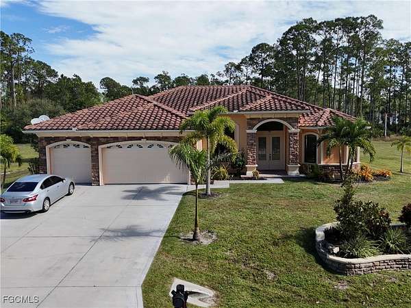 2 Acres of Residential Land with Home for Sale in Lehigh Acres, Florida