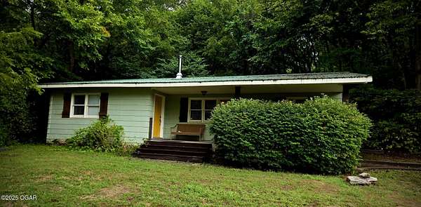 4 Acres of Residential Land with Home for Sale in Cassville, Missouri