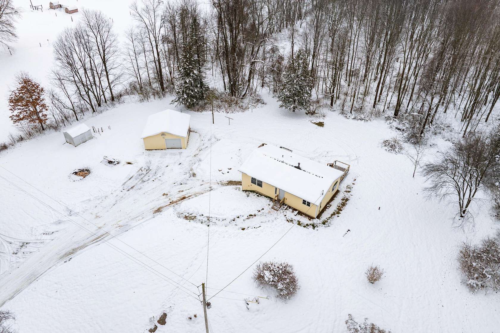 10 Acres of Residential Land with Home for Sale in Delton, Michigan