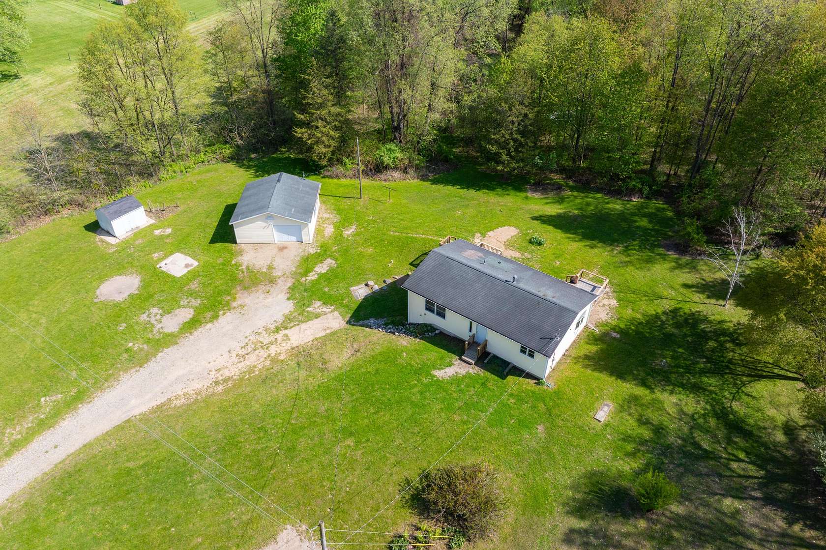10 Acres of Land with Home for Sale in Delton, Michigan