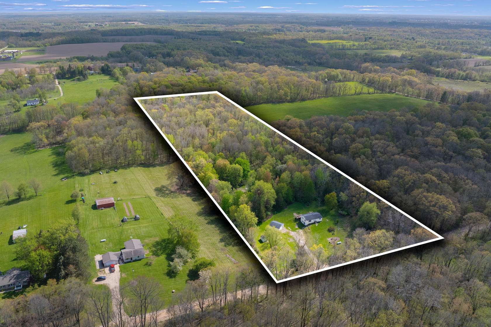 10 Acres of Land with Home for Sale in Delton, Michigan