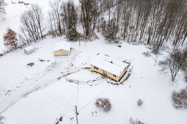 10 Acres of Residential Land with Home for Sale in Delton, Michigan