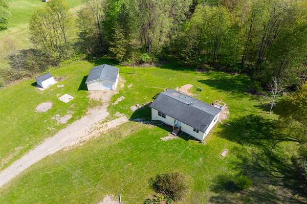10 Acres of Land with Home for Sale in Delton, Michigan