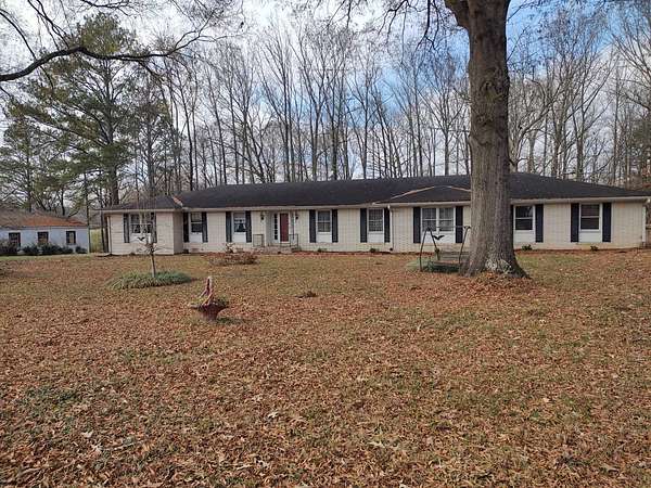 6.8 Acres of Residential Land with Home for Sale in Paris, Tennessee