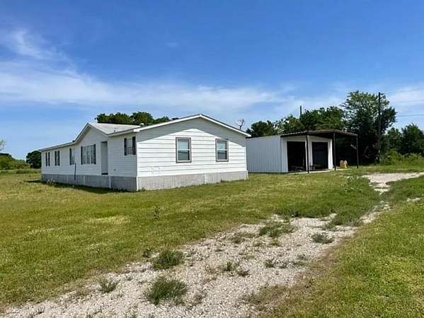 7.69 Acres of Residential Land with Home for Sale in Caddo Mills, Texas