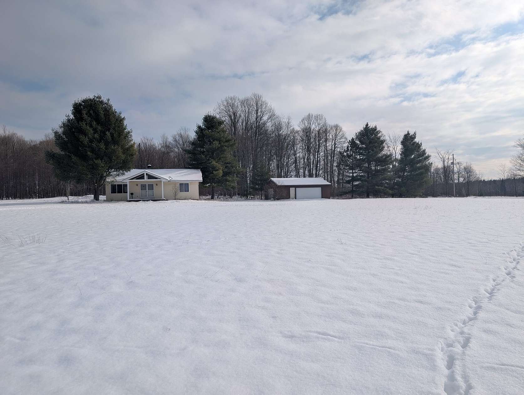 90 Acres of Recreational Land with Home for Sale in Manton, Michigan