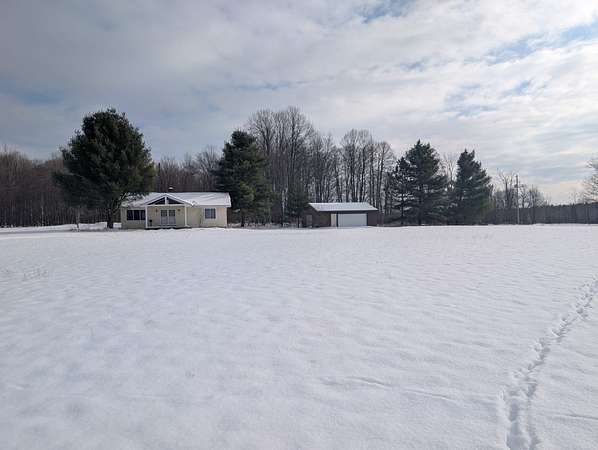 90 Acres of Recreational Land with Home for Sale in Manton, Michigan