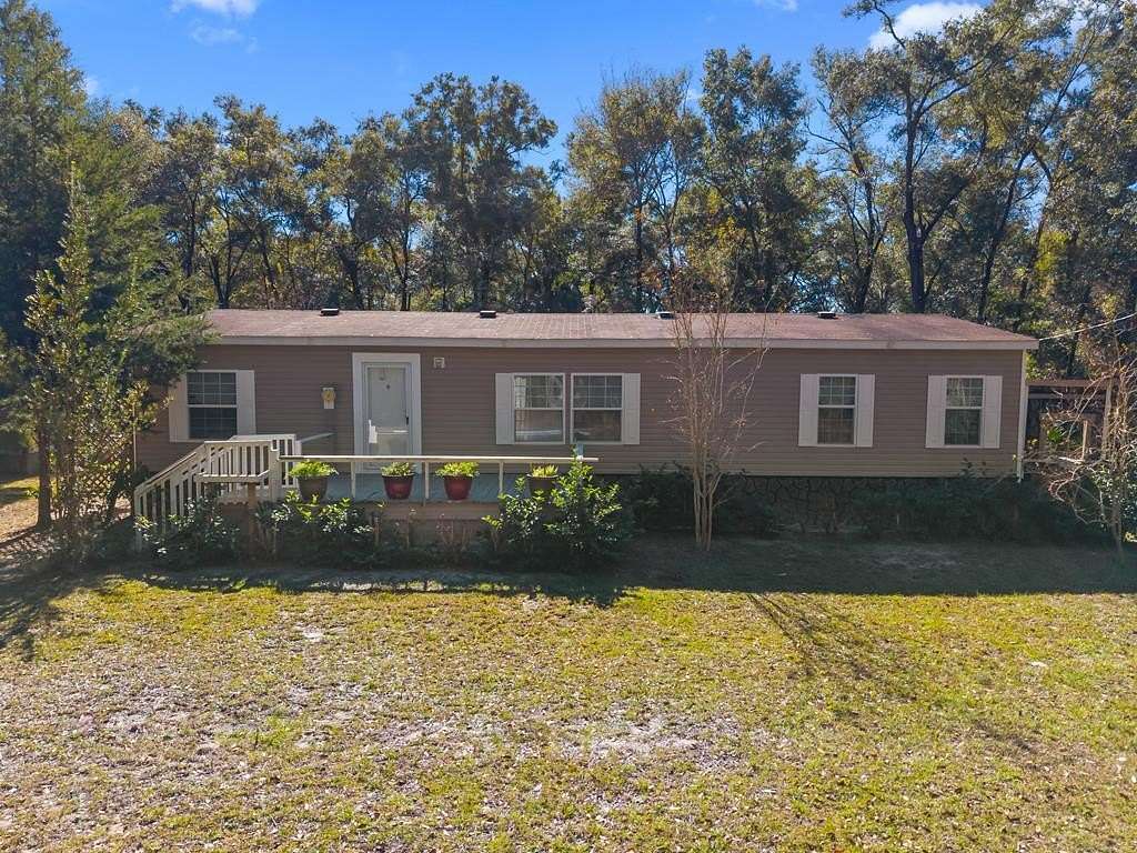 4.69 Acres of Residential Land with Home for Sale in Chiefland, Florida