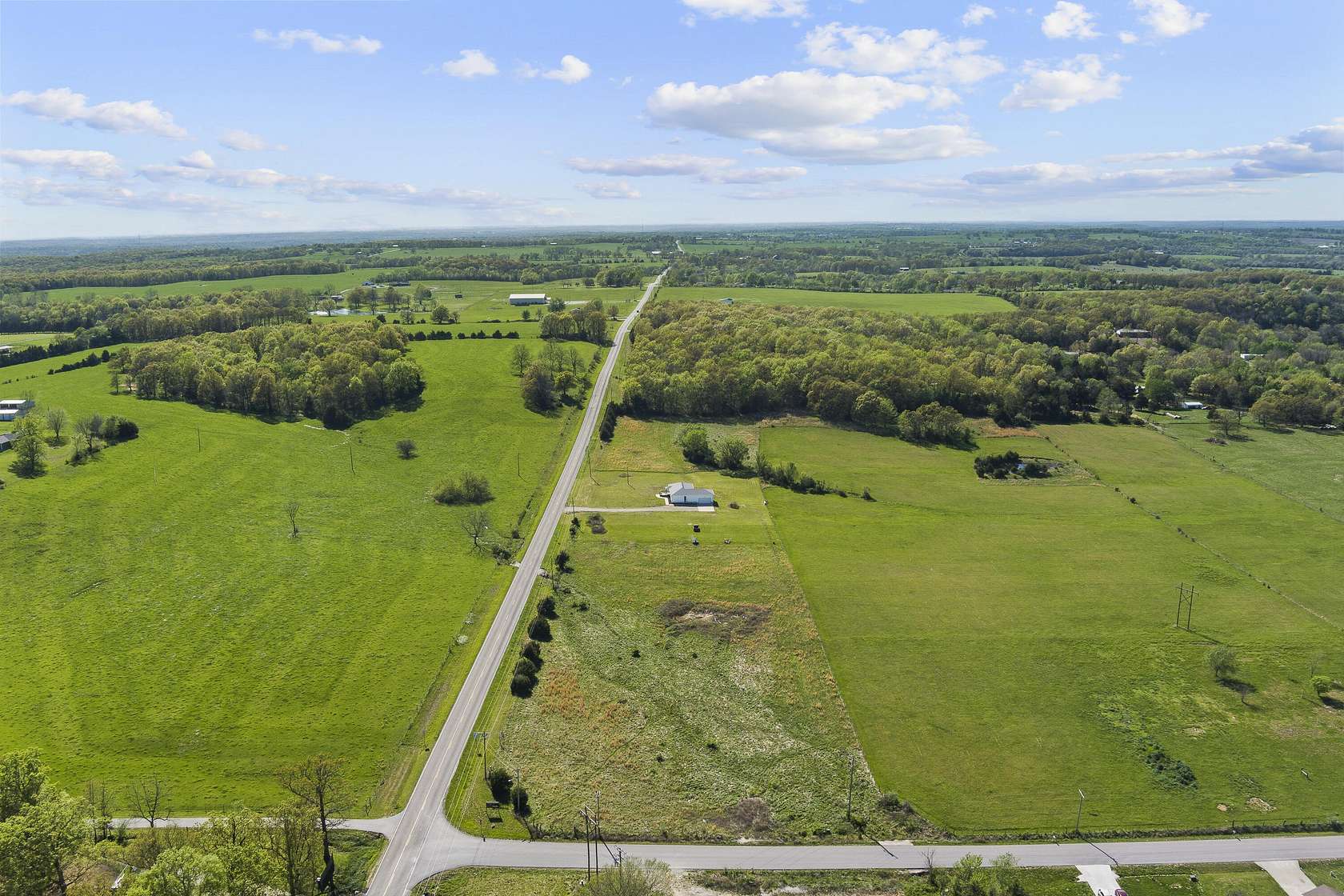 10 Acres of Land with Home for Sale in Pleasant Hope, Missouri