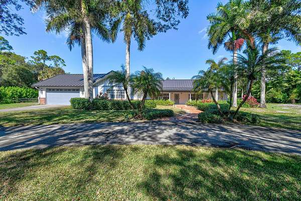1.69 Acres of Land with Home for Sale in Loxahatchee Groves, Florida