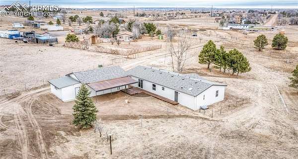 5.3 Acres of Residential Land with Home for Sale in Peyton, Colorado