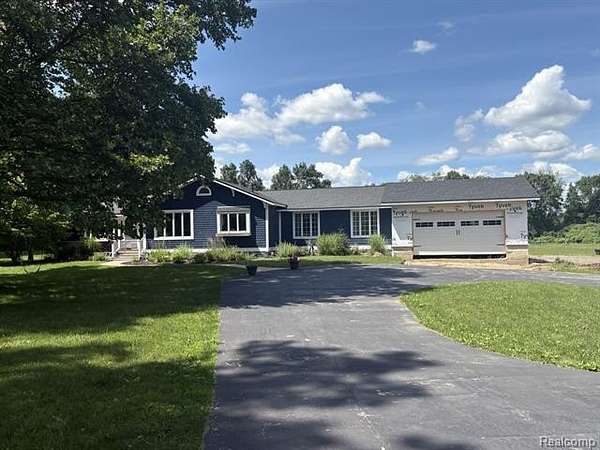5.25 Acres of Land with Home for Sale in Putnam Township, Michigan