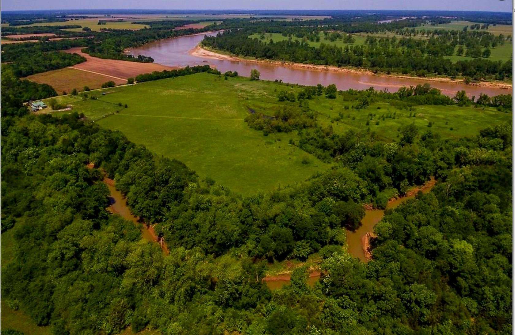 75 Acres of Recreational Land with Home for Sale in Arthur City, Texas