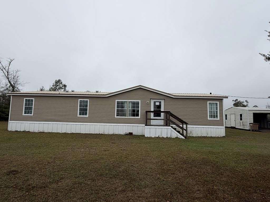 2.28 Acres of Residential Land with Home for Sale in Wewahitchka, Florida