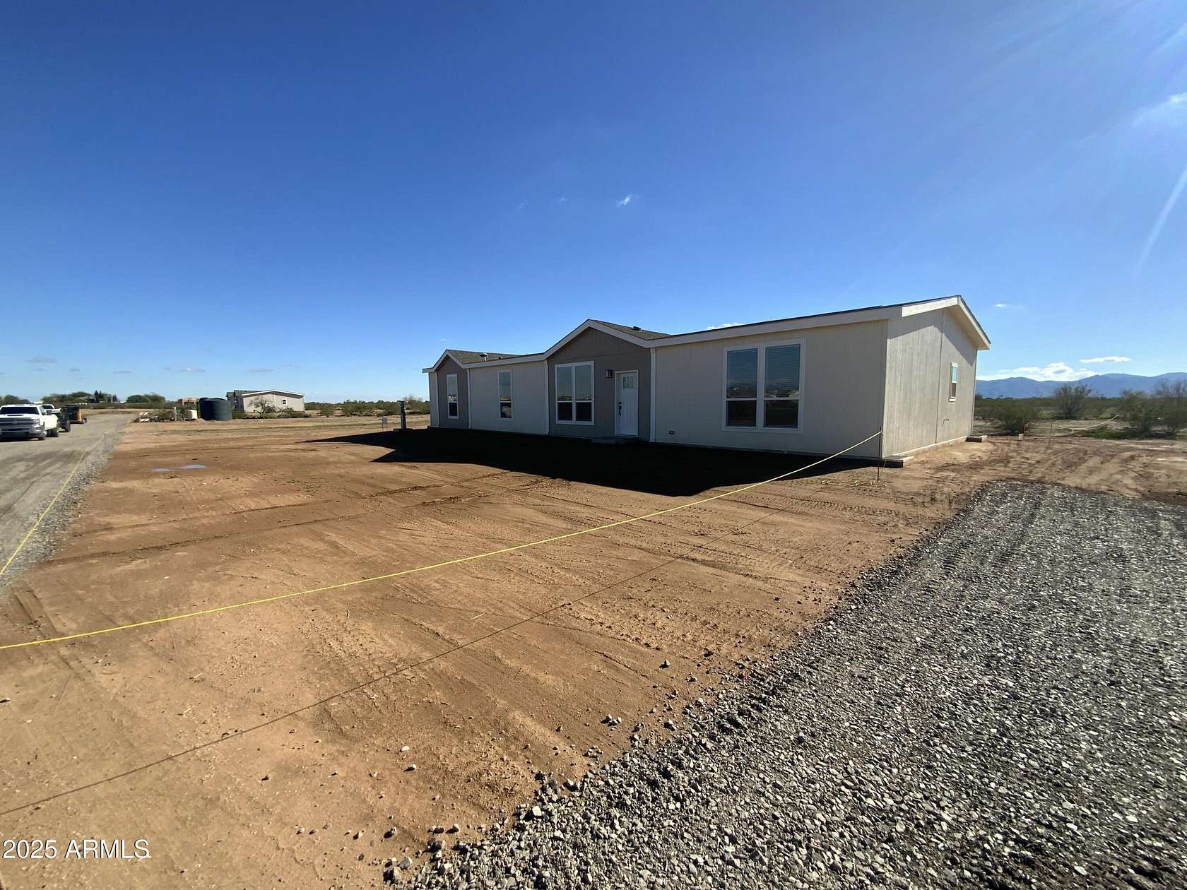 2 Acres of Residential Land with Home for Sale in Wittmann, Arizona