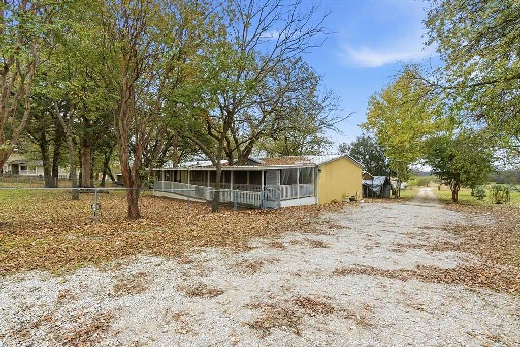 6.89 Acres of Land with Home for Sale in Springtown, Texas