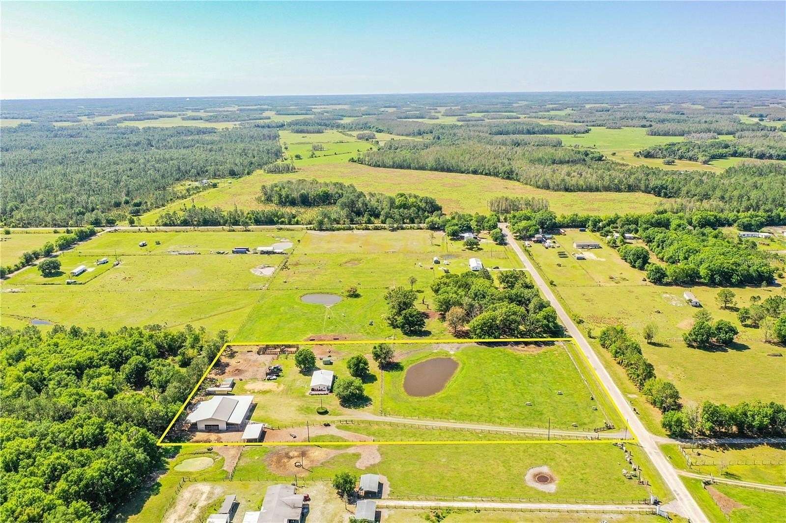 5 Acres of Residential Land with Home for Sale in Polk City, Florida
