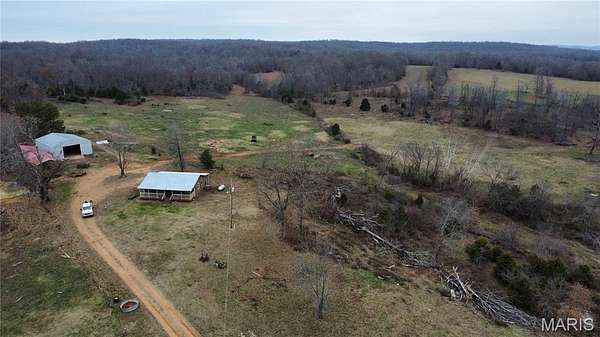 84 Acres of Agricultural Land with Home for Sale in Doniphan, Missouri