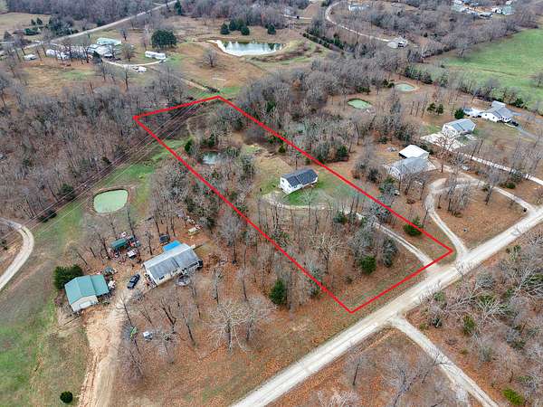 3 Acres of Residential Land with Home for Sale in Laquey, Missouri