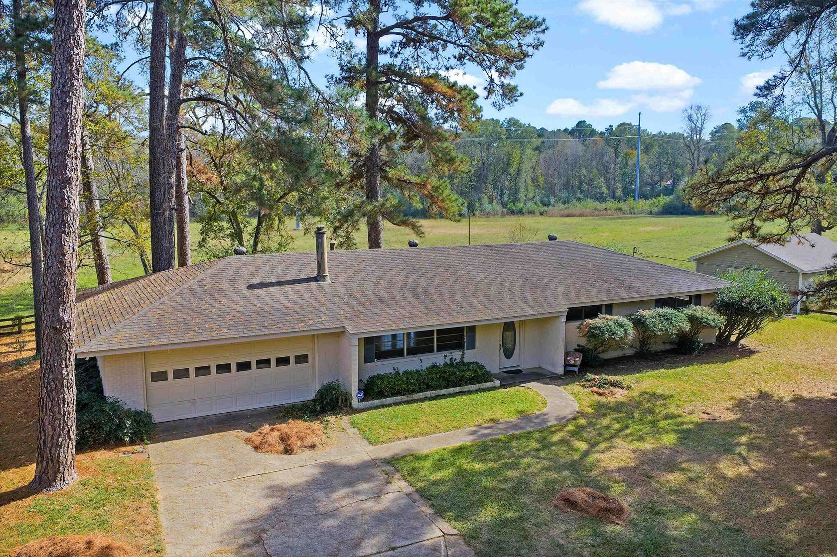 11.5 Acres of Land with Home for Sale in Carthage, Texas