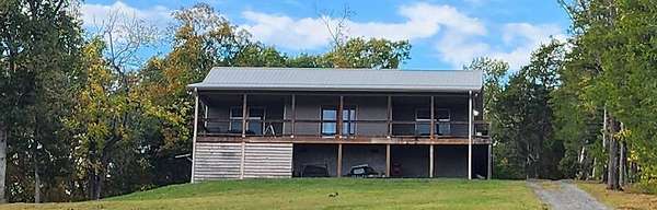 10.5 Acres of Land with Home for Sale in Sevierville, Tennessee