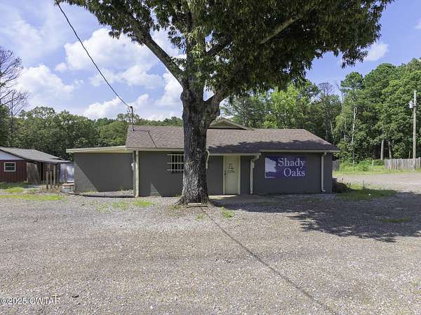 3.9 Acres of Residential Land with Home for Sale in Huron, Tennessee