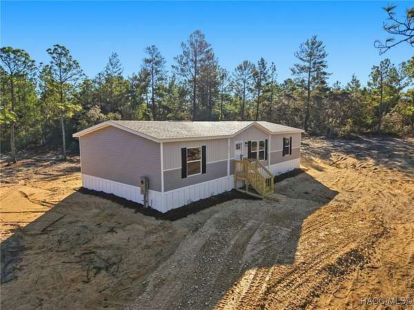 2.63 Acres of Residential Land with Home for Sale in Dunnellon, Florida