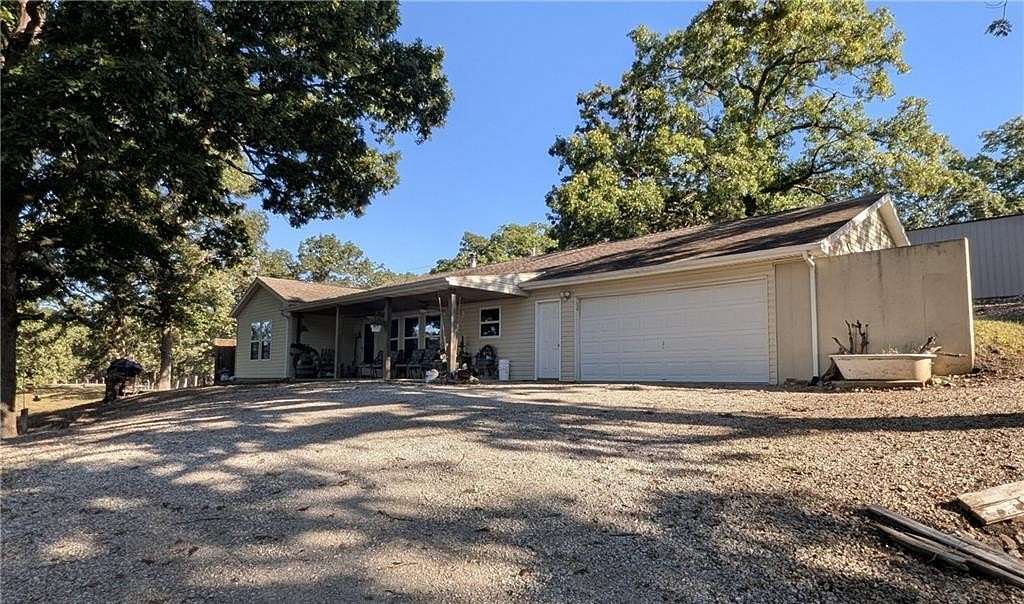 29.2 Acres of Recreational Land with Home for Sale in Warsaw, Missouri