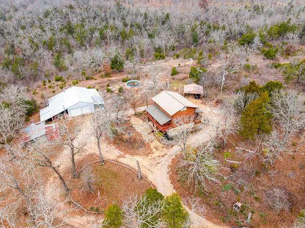 56 Acres of Land with Home for Sale in Cedarcreek, Missouri