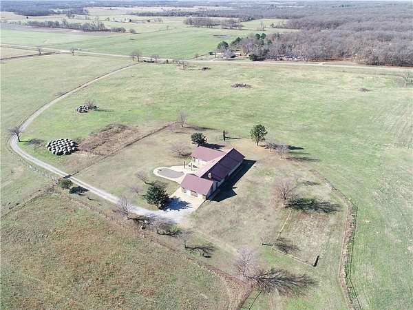22.2 Acres of Agricultural Land with Home for Sale in Gravette, Arkansas