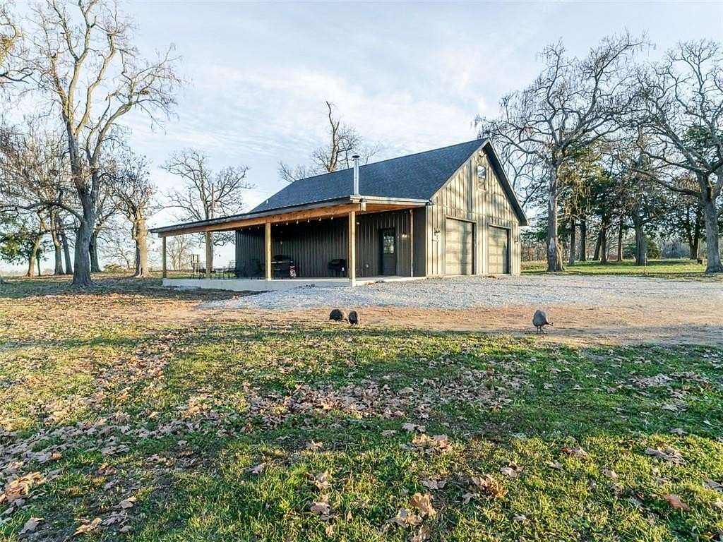 8 Acres of Residential Land with Home for Sale in Gravette, Arkansas