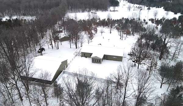 18 Acres of Recreational Land with Home for Sale in Manton, Michigan