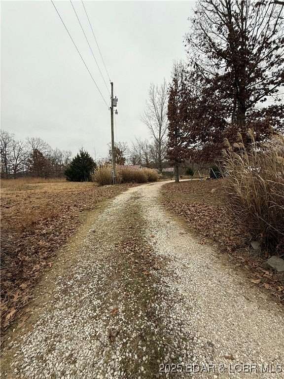 19.8 Acres of Land with Home for Sale in Sunrise Beach, Missouri