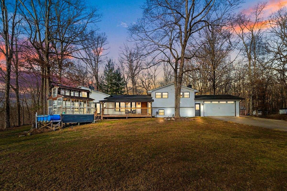 8.73 Acres of Residential Land with Home for Sale in Holladay, Tennessee