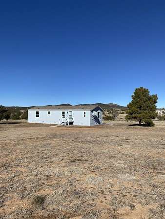 10 Acres of Residential Land with Home for Lease in Sandia Park, New Mexico