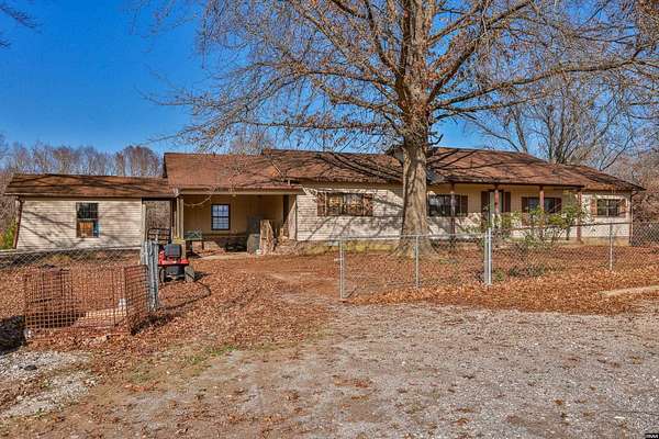 4.27 Acres of Land with Home for Sale in Cottage Grove, Tennessee