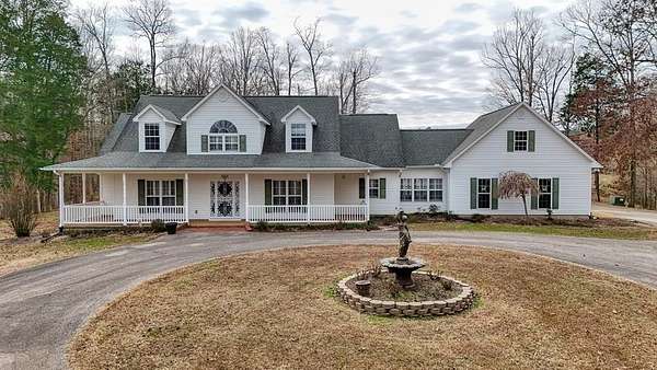 10.9 Acres of Land with Home for Sale in Jackson, Tennessee