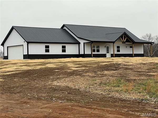 4.9 Acres of Residential Land with Home for Sale in Madison, Missouri