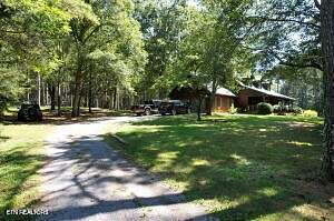 6.5 Acres of Land with Home for Sale in Oldfort, Tennessee