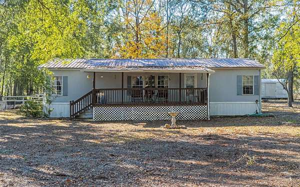 4.82 Acres of Residential Land with Home for Sale in Live Oak, Florida