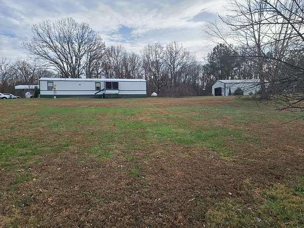 3.13 Acres of Land with Home for Sale in Big Sandy, Tennessee