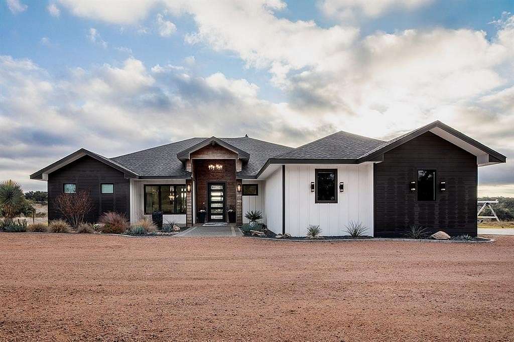 130 Acres of Agricultural Land with Home for Sale in Brady, Texas