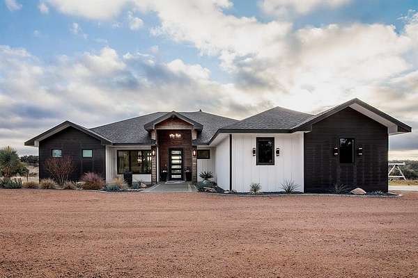 130 Acres of Agricultural Land with Home for Sale in Brady, Texas