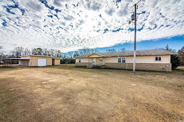 6.46 Acres of Land with Home for Sale in Leola, Arkansas