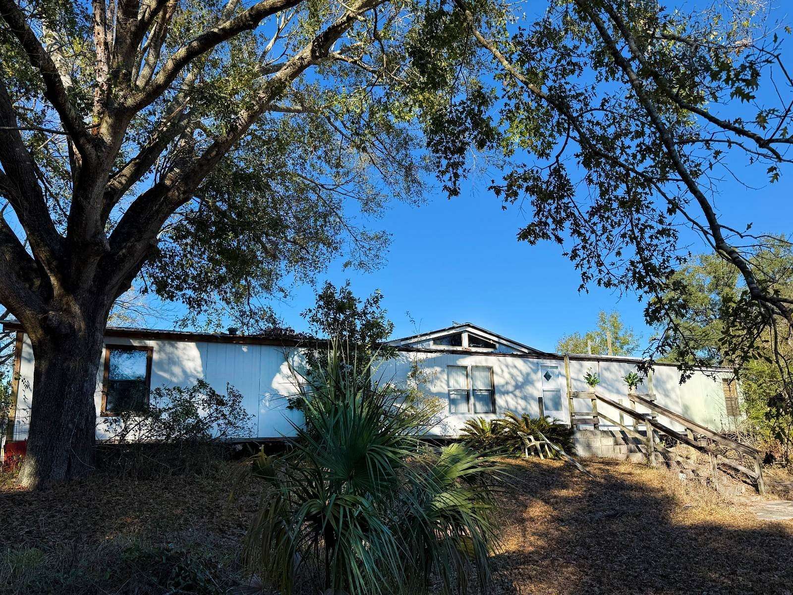 5 Acres of Residential Land with Home for Sale in Chiefland, Florida