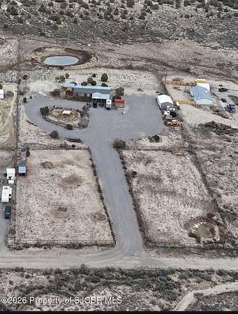 5 Acres of Land with Home for Sale in Aztec, New Mexico