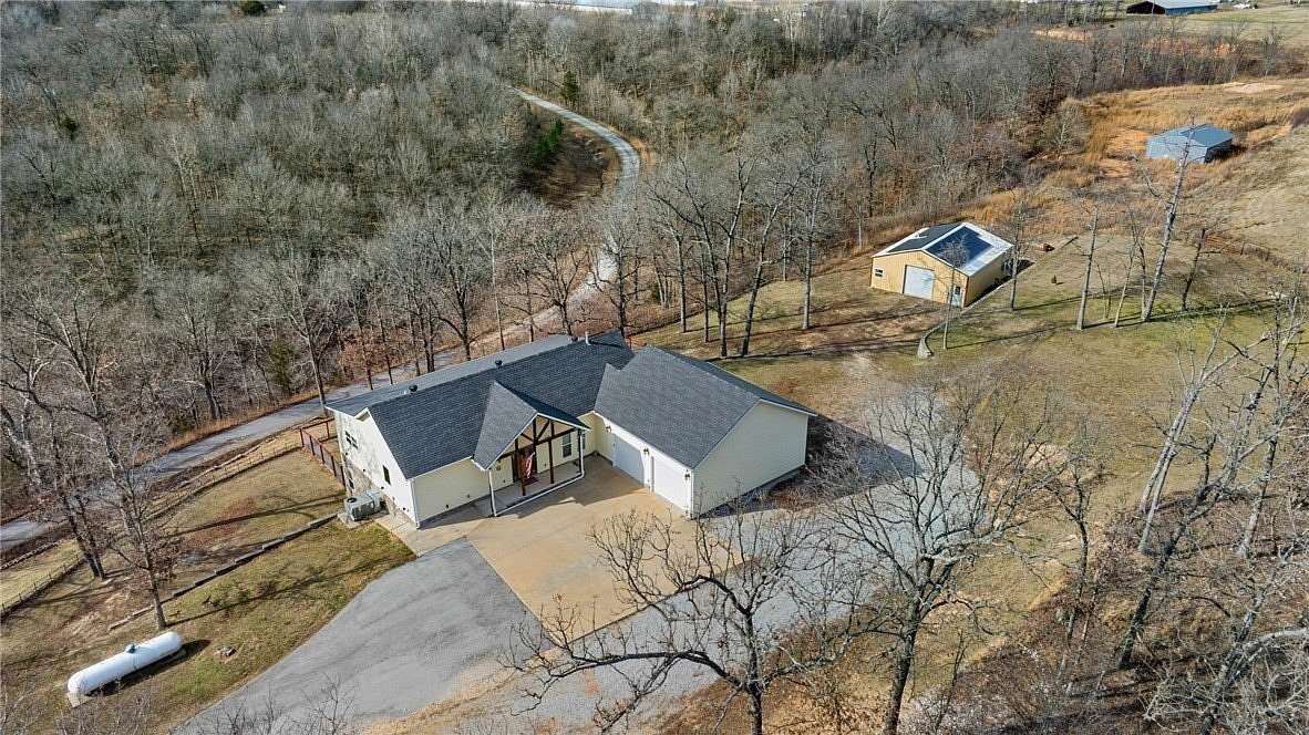 10 Acres of Land with Home for Sale in Gravette, Arkansas